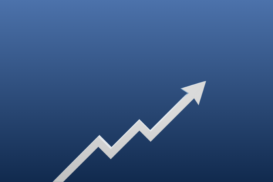 Outsource your fulfilment to meet business growth - image depicts a white arrow moving in an upwards trajectory, against a navy blue, gradient background.